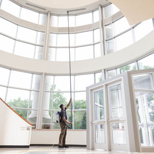 Reaching a high wall vent from the floor with GoHigh Max in a two-story lobby
