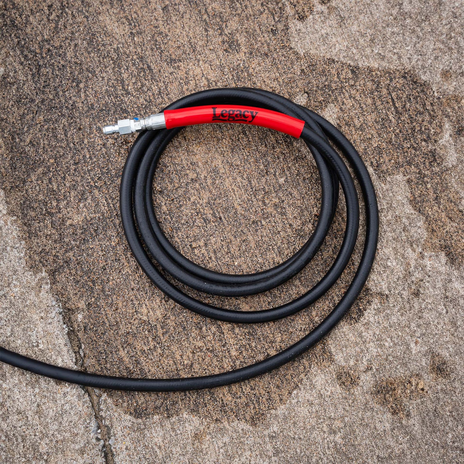 Legacy black pressure washer hose with red bend restrictors